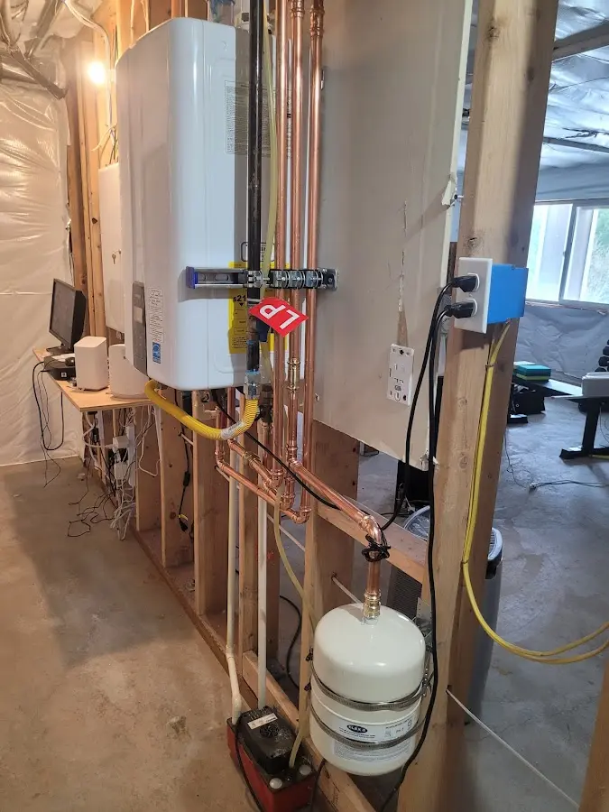 Licensed plumber repairing a kitchen sink in Brewster